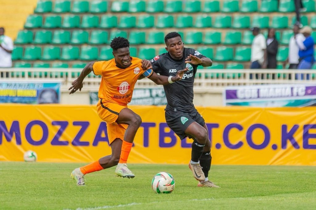 Patrick Esombe of Gor Mahia battles for possession with Joseph Tindo of BB Bread FC during their Mozzart Bet Cup Match