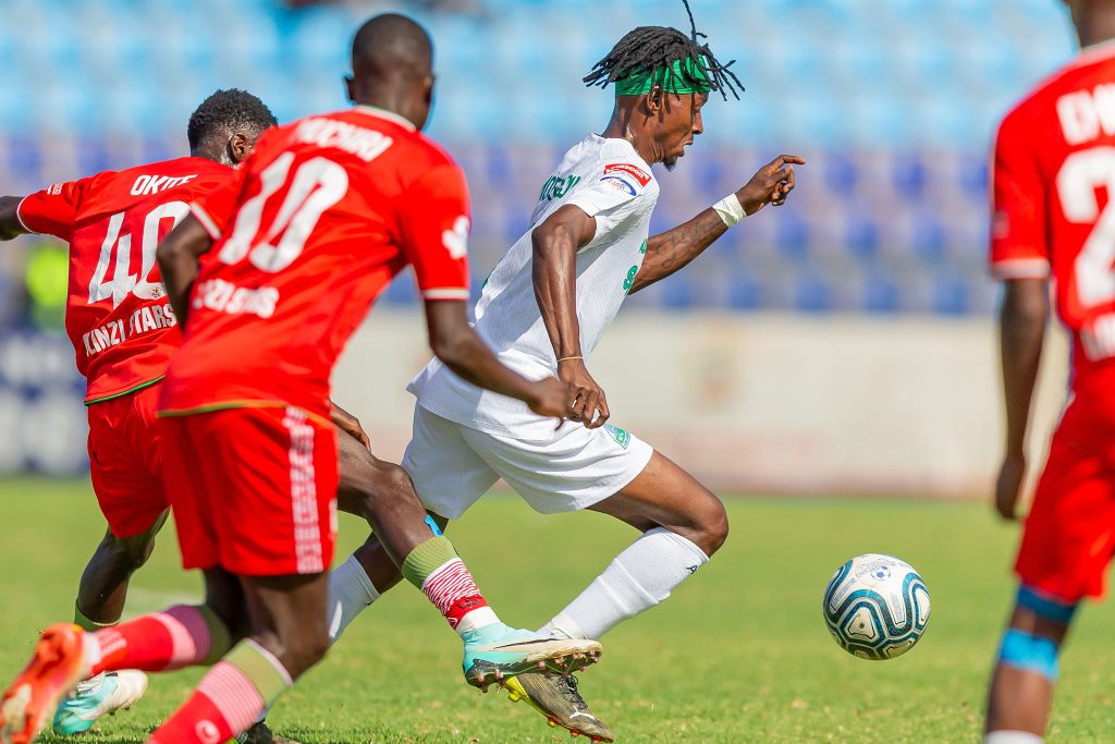 Enoch Morisson dribbles the ball past ulinzi players at ulinzi complex